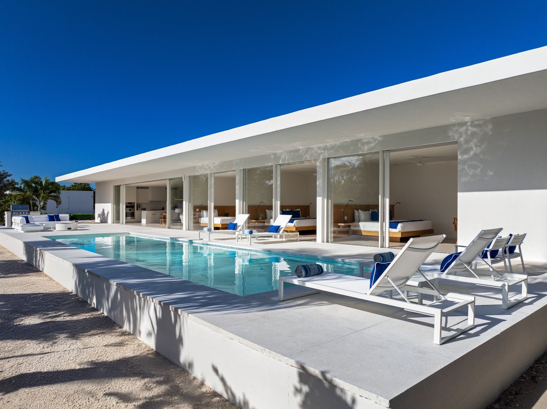 Sun loungers sit adjacent to the swimming pool